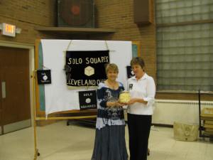 Carolyn presenting the cakewalk cake to Caroline